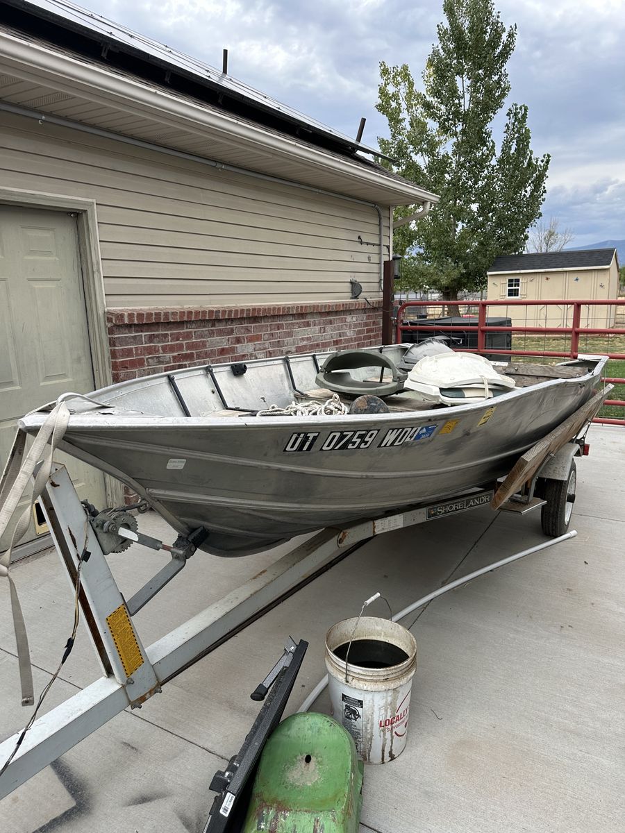Older Gregor aluminum boat and trailer.