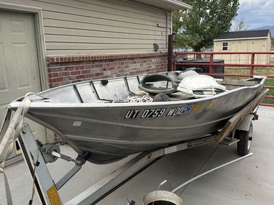 Older Gregor aluminum boat and trailer.