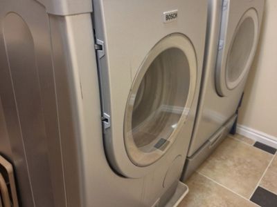 Used Electric Bosch Front-Load Washer and Dryer.
