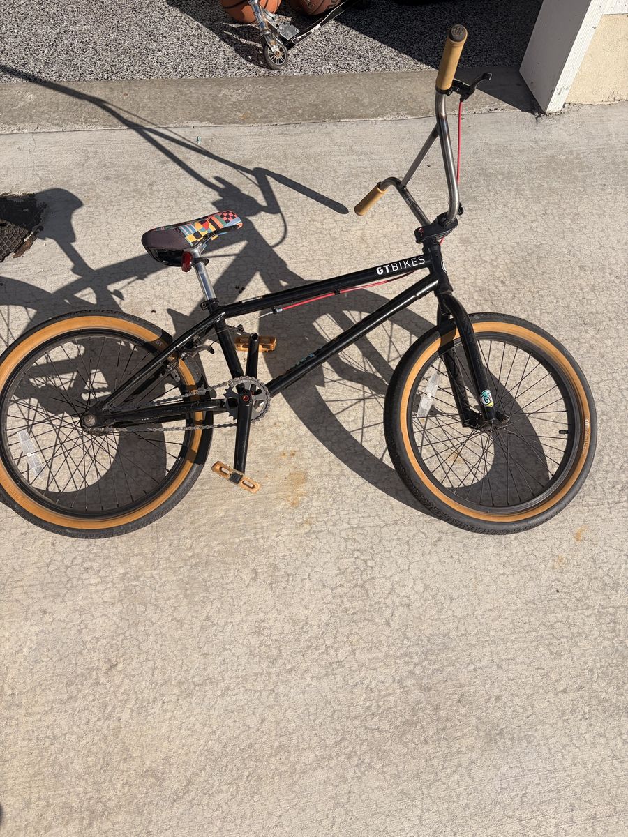 GT Bikes BMX Freestyle Bike - Black with Tan Wall Tires & Colorful Seat - Good Condition