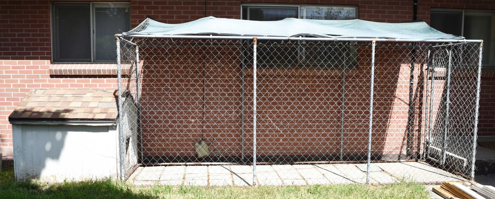 Dog kennel with attached dog house