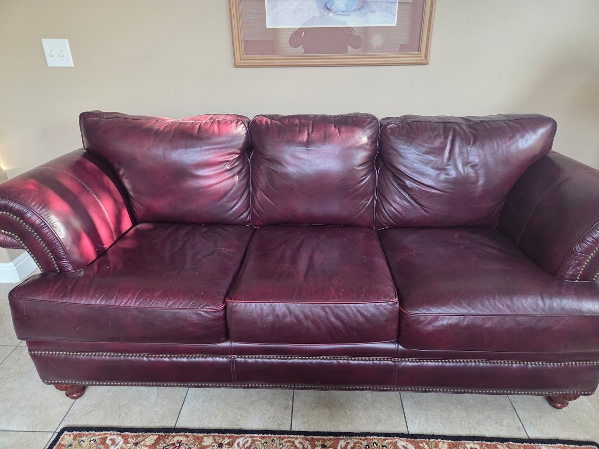 Red leather couches 1 loveseat ($30) 1 couch ($45)