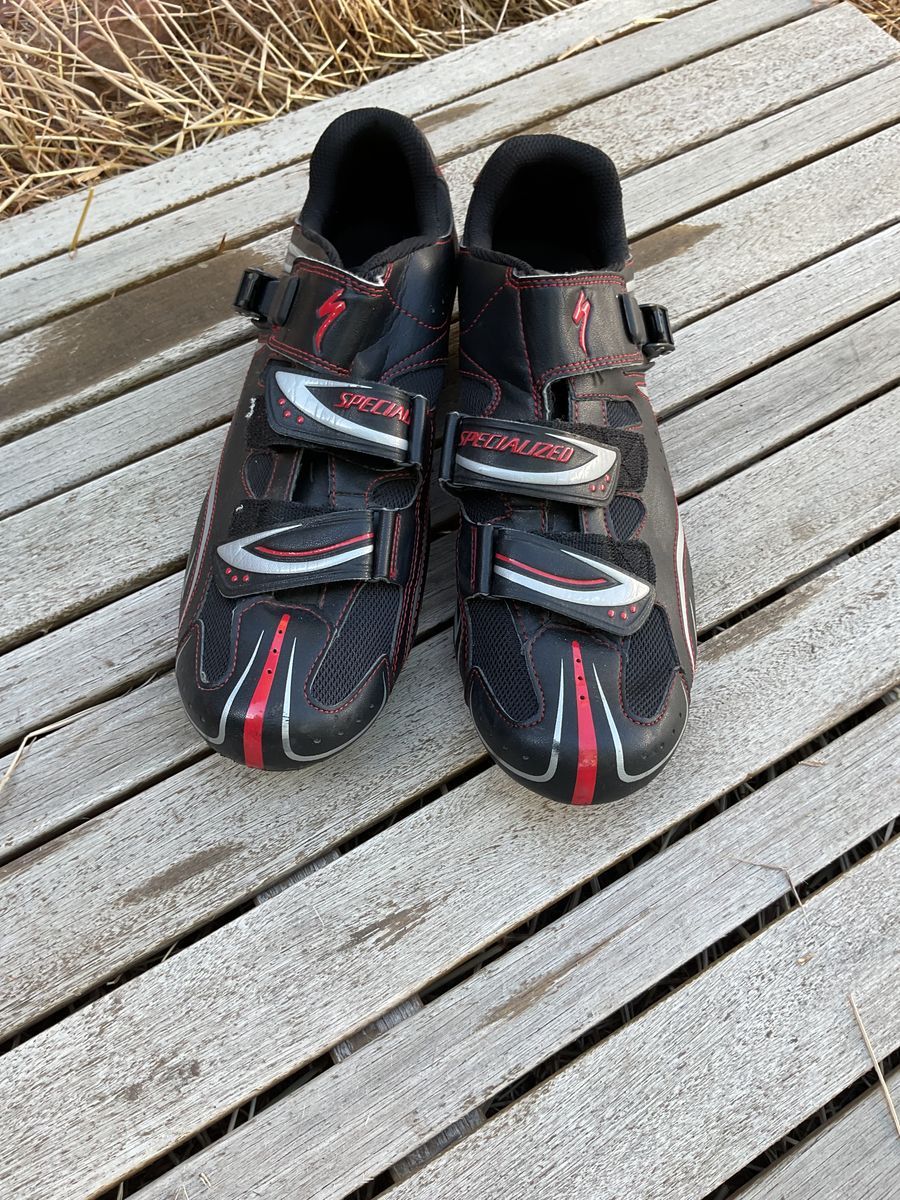 black and white and red mountain biking shoes