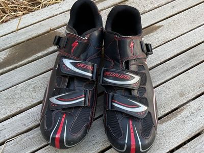 black and white and red mountain biking shoes
