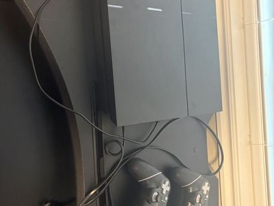 Sony PlayStation 4 Console with 2 Controllers and Power Cable