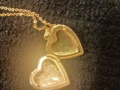 Gold colored heart shaped photo pendant necklace