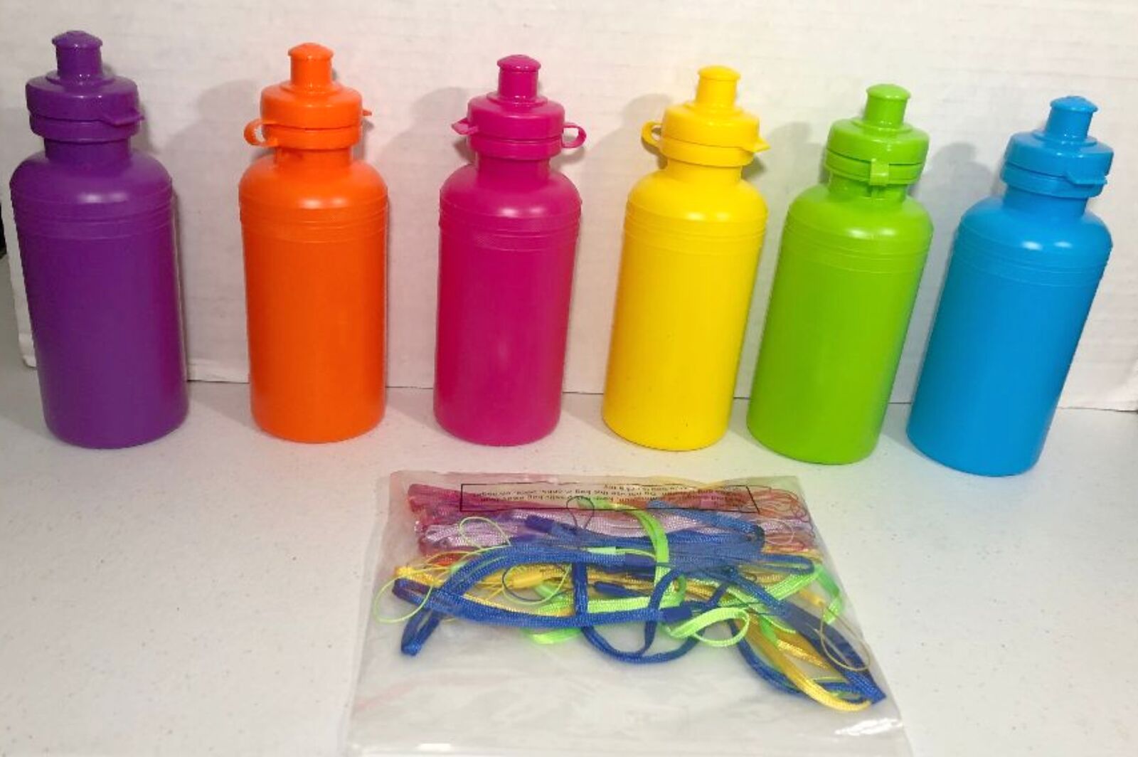 7 1/2" 18 oz. Bulk 60 Ct. Neon Solid Color BPA-Free Plastic Water Bottles with Strap Kit
