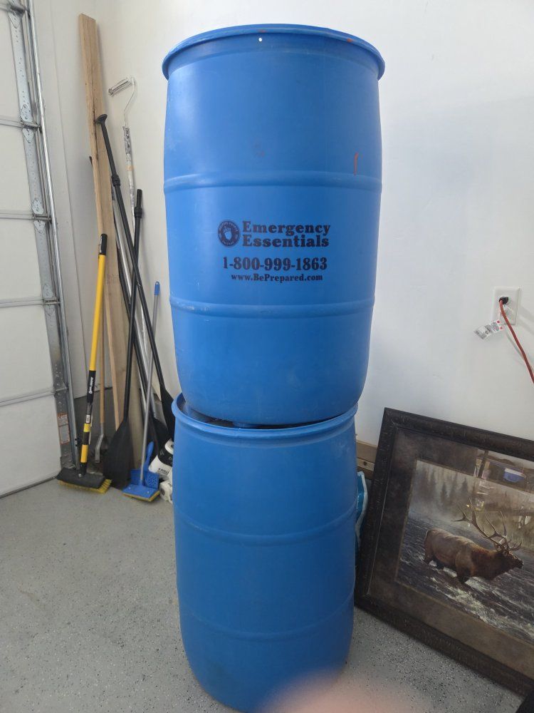 2 Emergency Essentials 55-Gallon Blue Plastic Water Storage Barrels Drums.  used for water and stored in the garage.