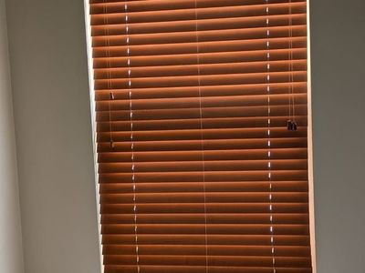 Upgrade your home with these beautiful 2-inch real wood window blinds in excellent condition