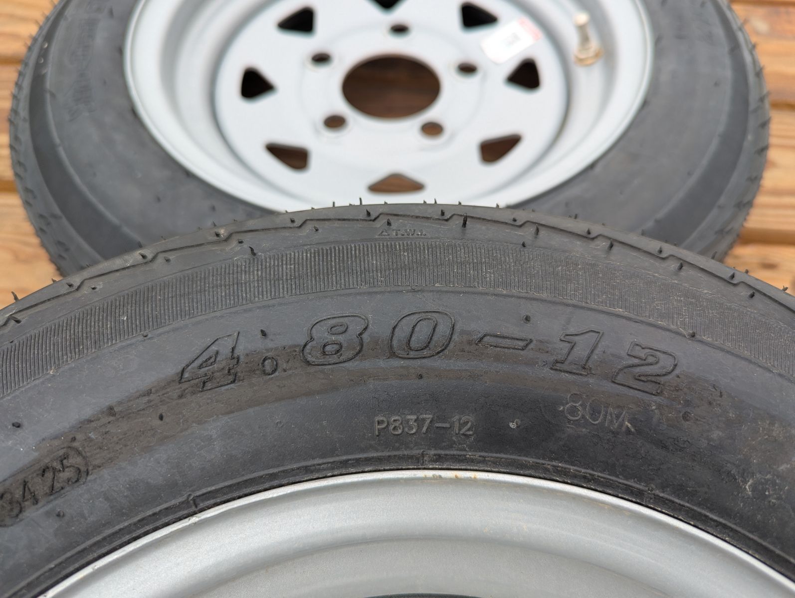 Two, brand-new 4.8 x 12" utility trailer wheels and tires