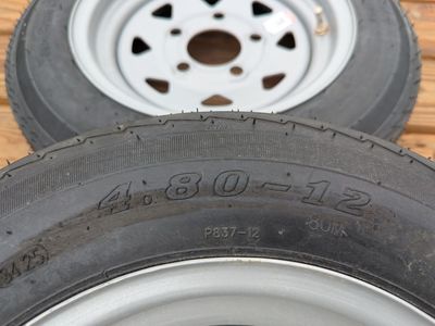 Two, brand-new 4.8 x 12" utility trailer wheels and tires