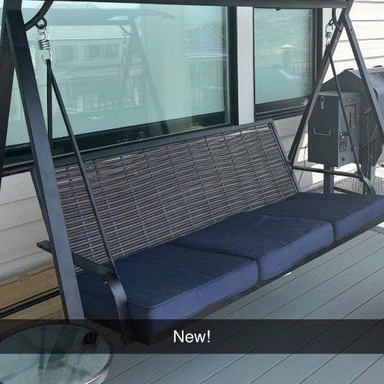 Porch swing with canopy and glass tables