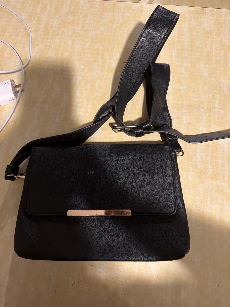 Black Crossbody Bag with Adjustable Strap and Gold-Tone Hardware