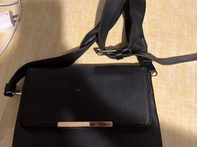 Black Crossbody Bag with Adjustable Strap and Gold-Tone Hardware