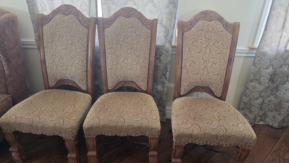 Ornate Carved Wooden Dining Chairs with Patterned Upholstery