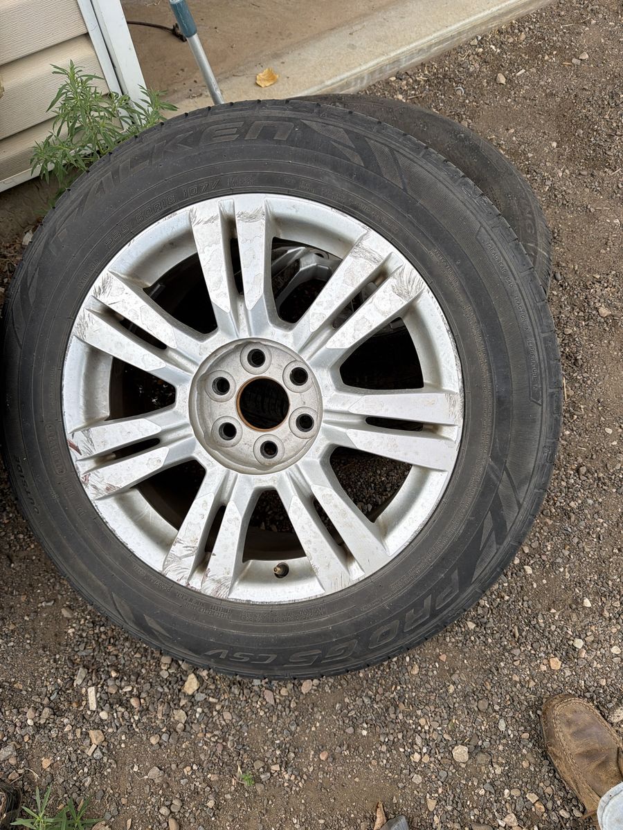 Cadillac STX Used 235/65R18 Tires on Silver Aluminum Wheels - Good Tread