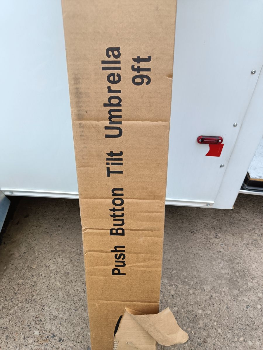New in box, 9 foot shade umbrella.