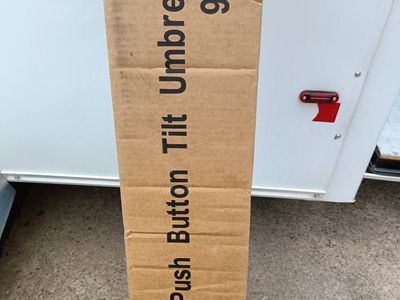 New in box, 9 foot shade umbrella.