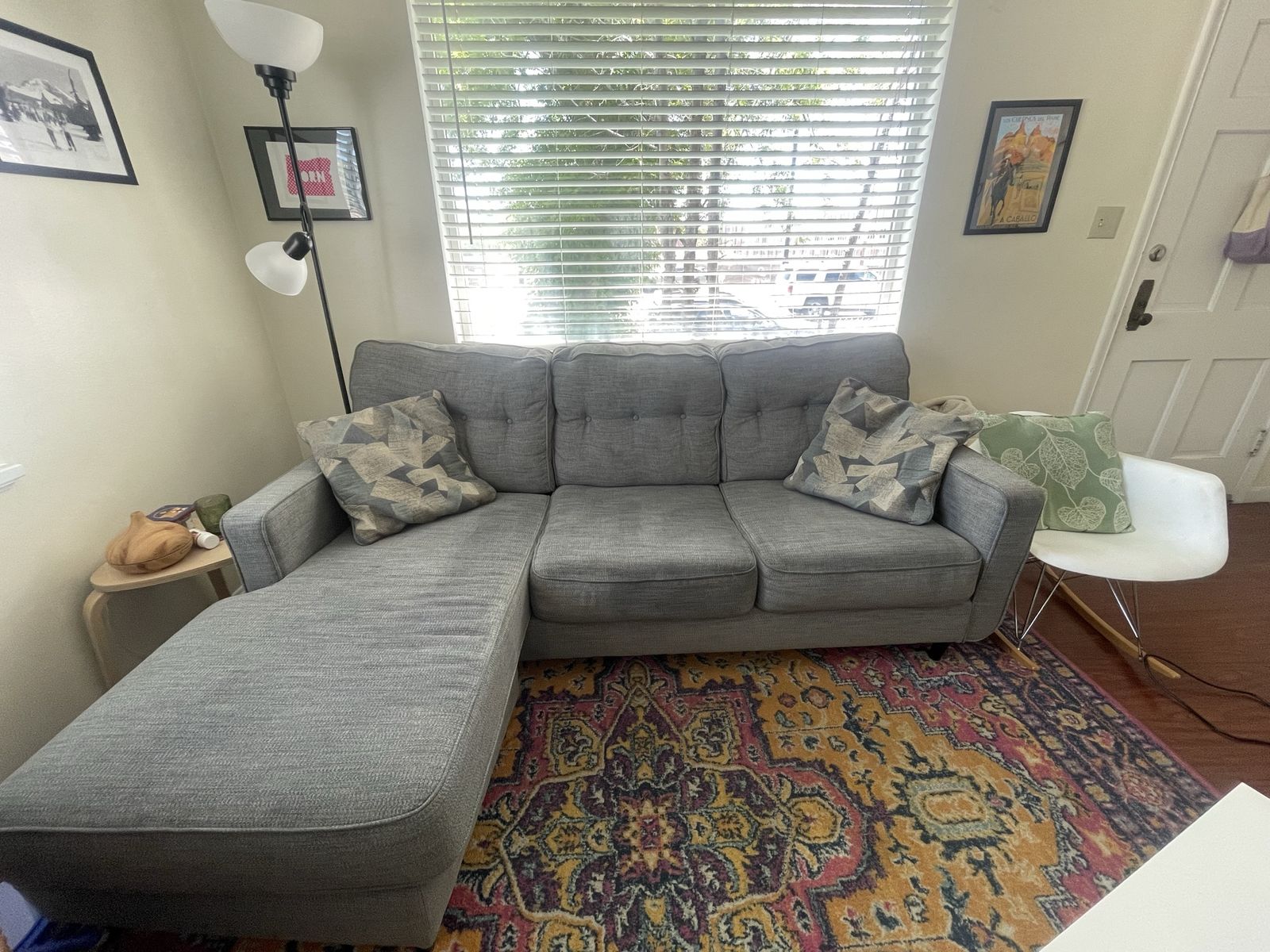 IKEA blue grey couch with decorative pillows