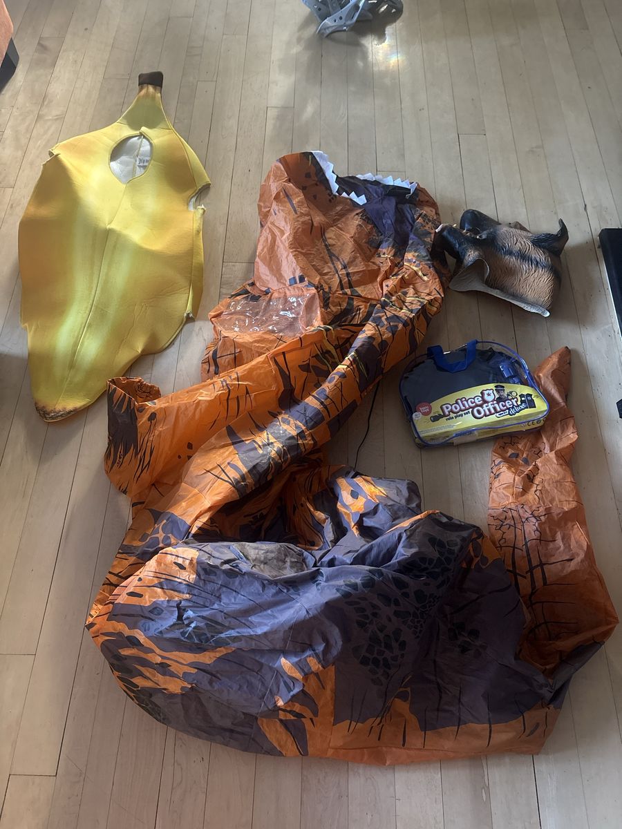 Halloween costume including inflatable Dino, kids police, dog mask and kids banana. $65 for all of them or can sell separately