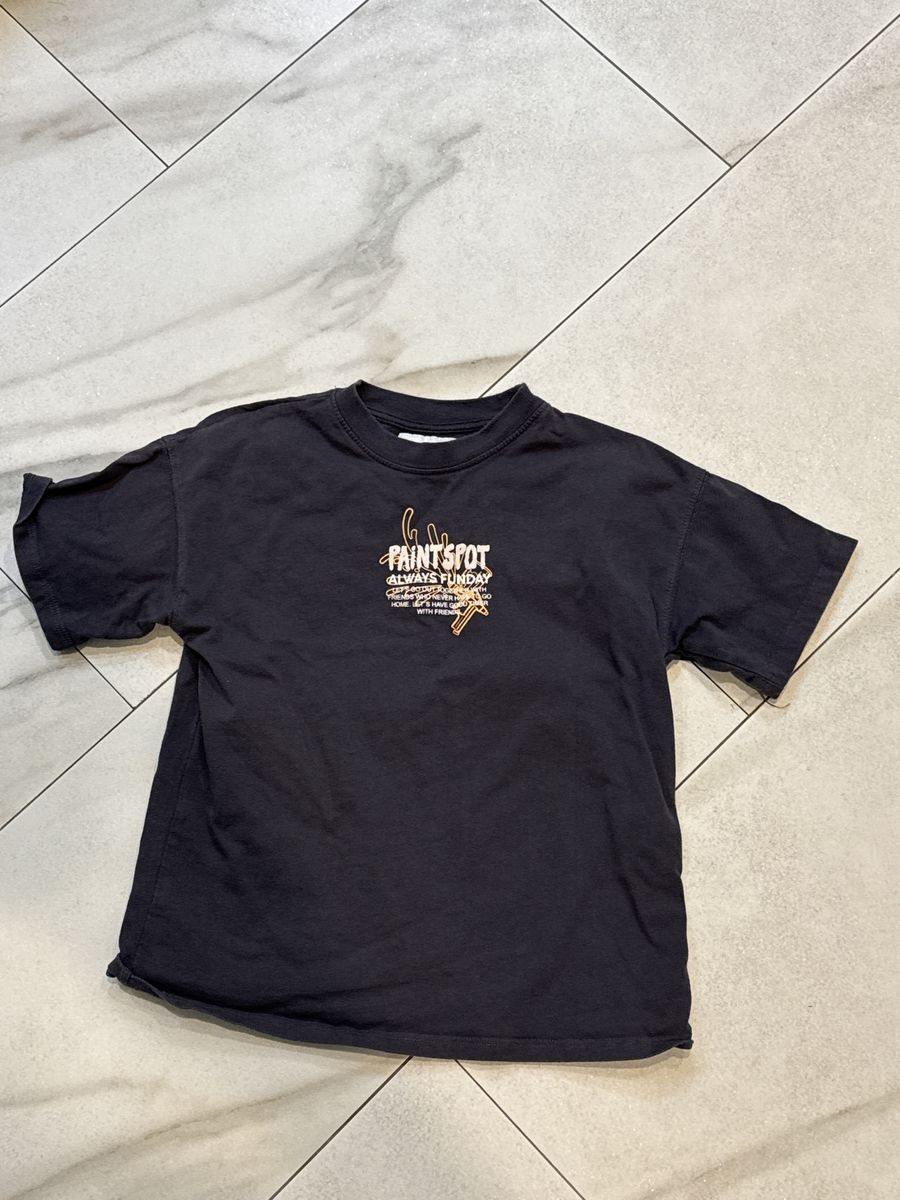 Zara says 6–7 grey T-shirt.