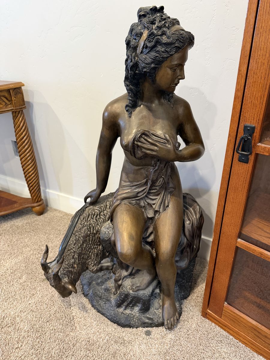 Woman On Goat Statue
