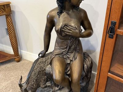 Woman On Goat Statue