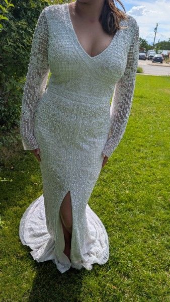 Hand beaded long sleeve wedding dress with train