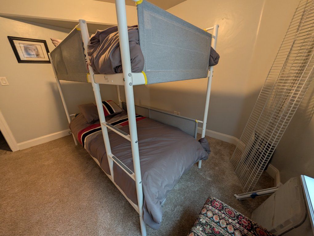 IkeaWhite Metal Twin Bunk Bed Frame with Fabric Guard Rails and Built-in Ladder bought for $350