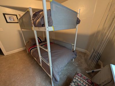 IkeaWhite Metal Twin Bunk Bed Frame with Fabric Guard Rails and Built-in Ladder bought for $350