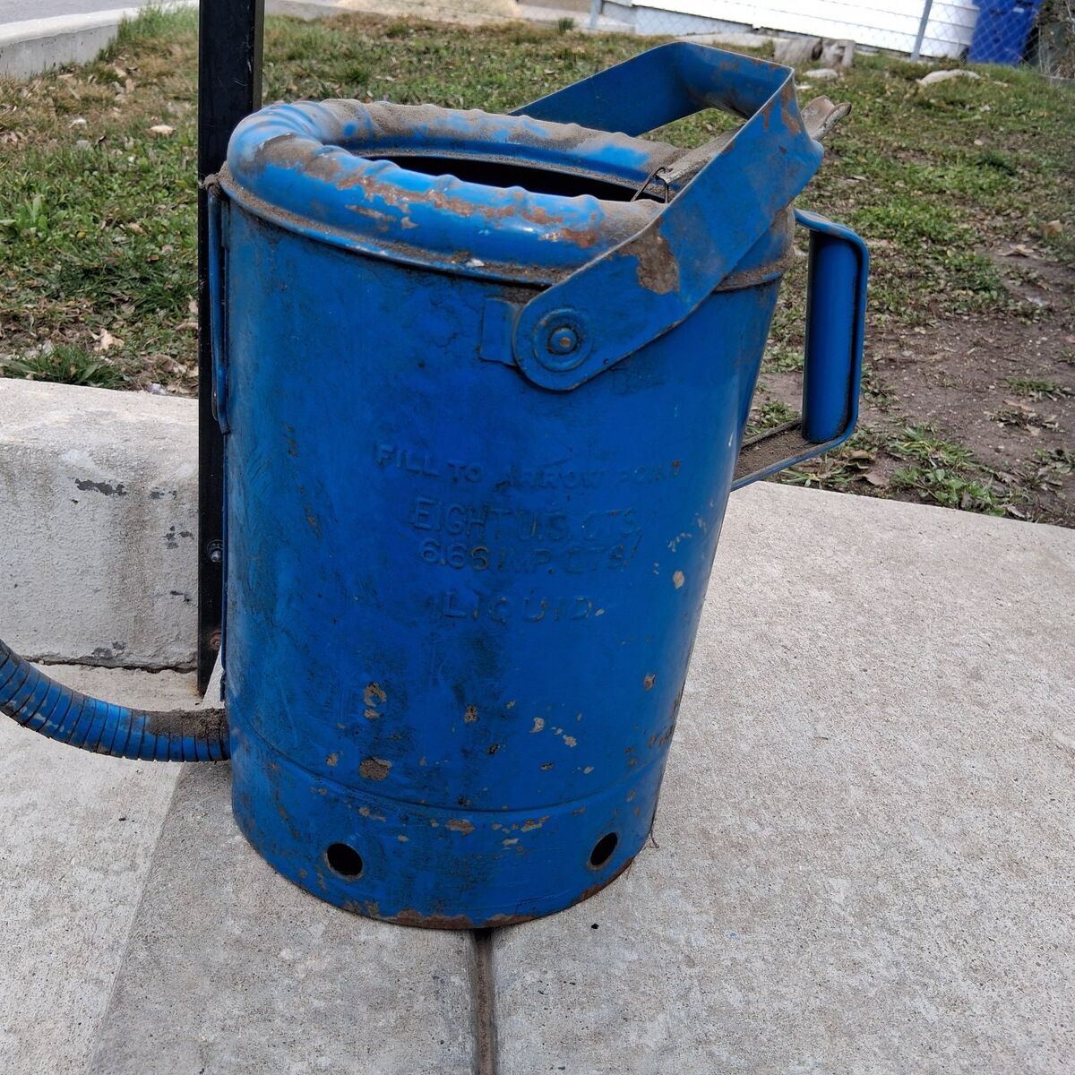 vintage 1950 oil can with flexible drain tube