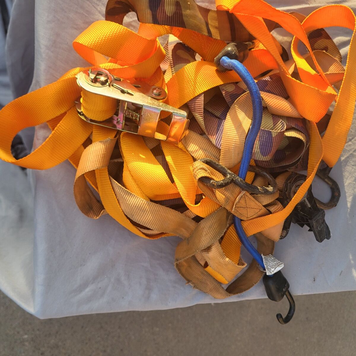 bundle of tie downs and ratchet straps