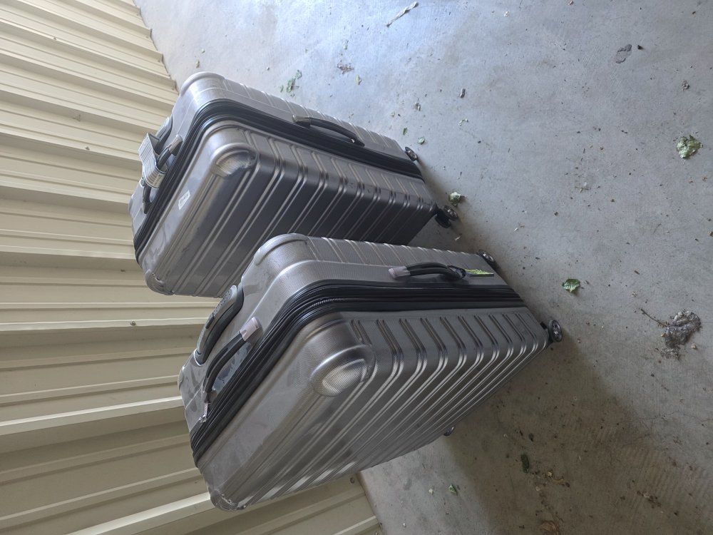Pair of Large iFLY Hardside Checked Suitcases