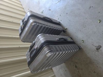 Pair of Large iFLY Hardside Checked Suitcases