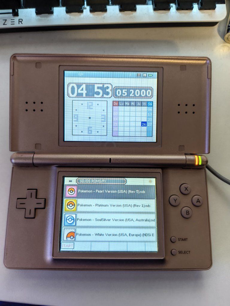 Nintendo ds lite rose gold with r4 cartridge