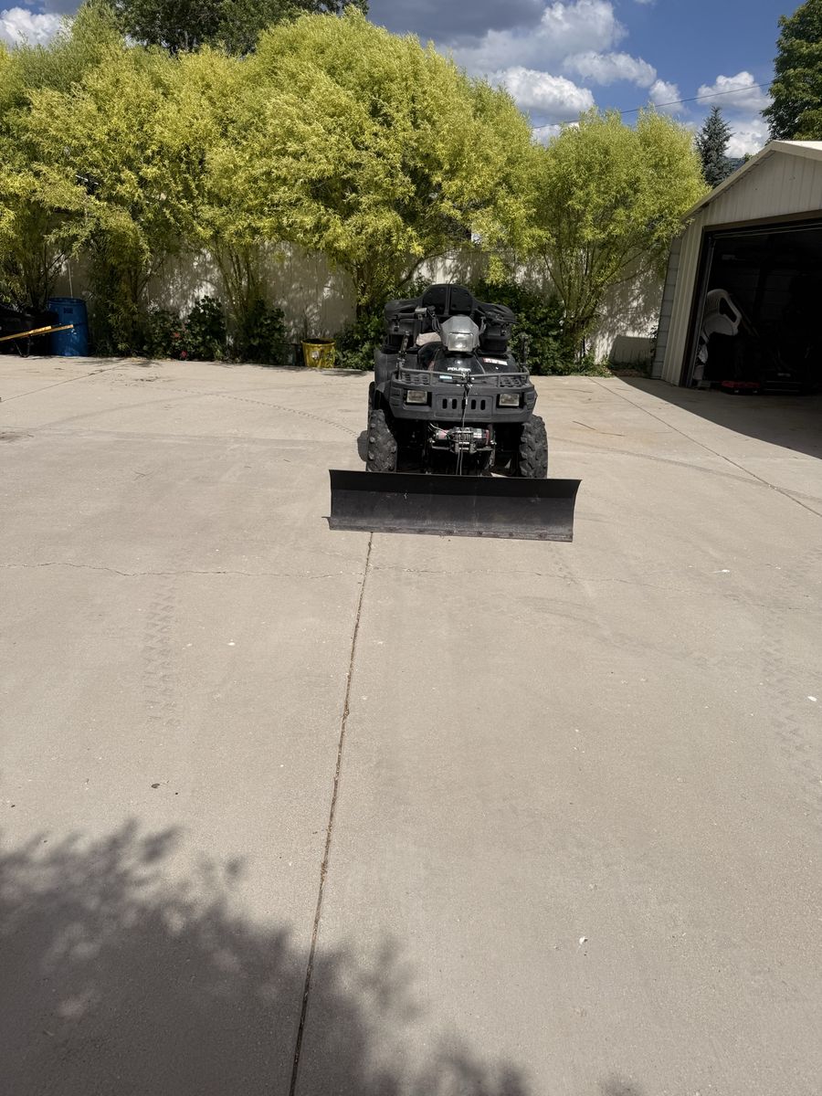 Polaris Sportsman 4x4 ATV with Plow and Rear Cargo Box - Great for All-Season Use