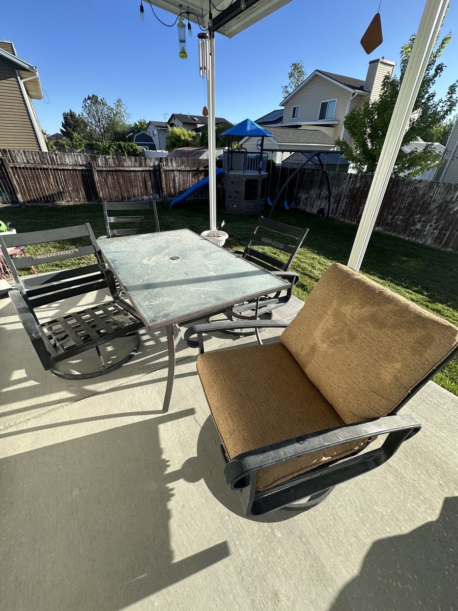 Swiveling rocking chairs and table.