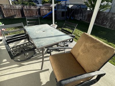 Swiveling rocking chairs and table.