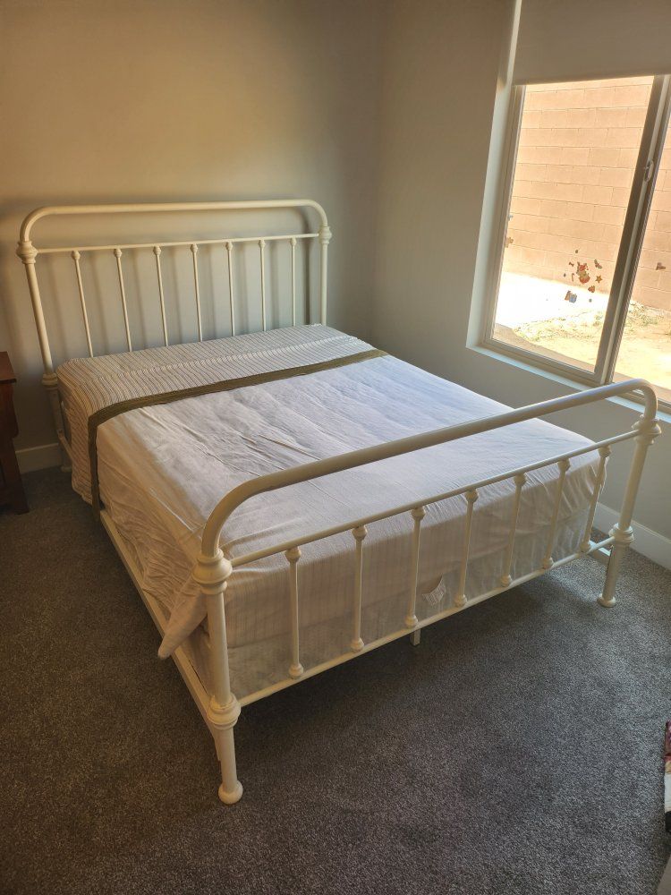 White steel frame bed