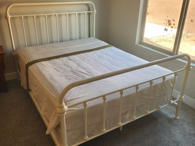 White steel frame bed