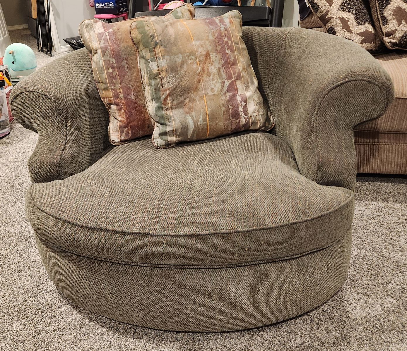 Large green "cuddle" chair