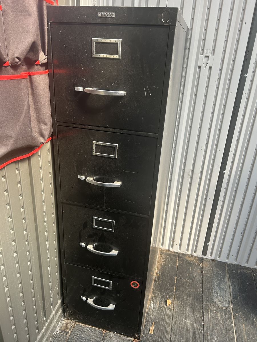 Sturdy 4 drawer metal filing cabinet.
