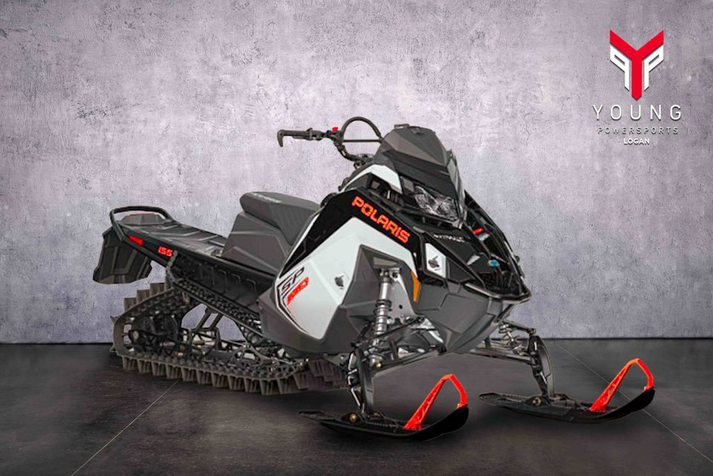 2027 Polaris® 850 RMK SP 155 ES White Lightning / Gloss Black / Orange Burst
