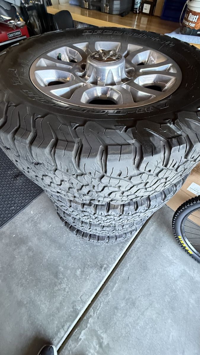 2018 Ram 2500 OEM stock 18" silver alloy wheels with BFGoodrich All-Terrain T/A KO2 LT275/70R18 Load Range E tires.