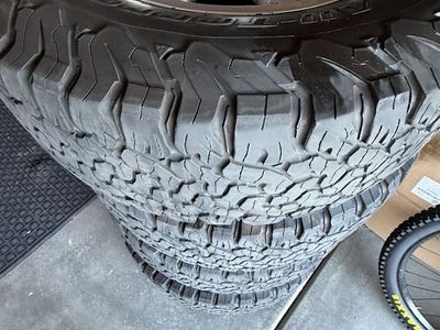 2018 Ram 2500 OEM stock 18" silver alloy wheels with BFGoodrich All-Terrain T/A KO2 LT275/70R18 Load Range E tires.