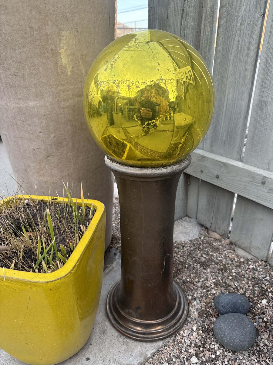 Glass Yard Orb on Concrete Pedestal Gold Amber