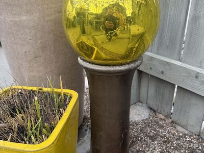 Glass Yard Orb on Concrete Pedestal Gold Amber