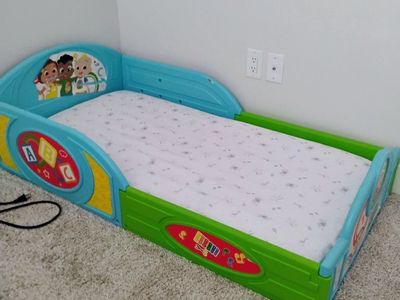 Delta Children CoComelon Toddler Bed - Plastic Frame, Ages 15m+ - with Mattress