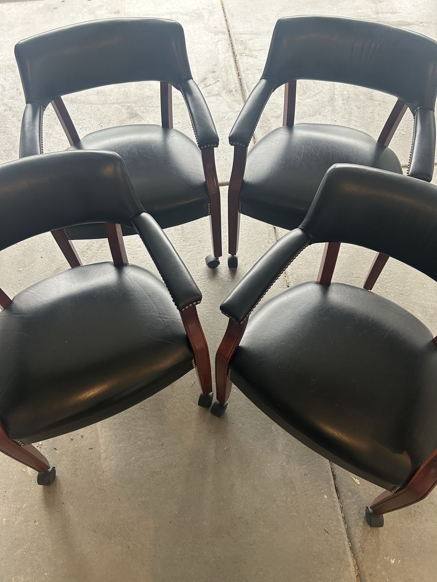 Set of 4 faux leather/wood rolling chairs