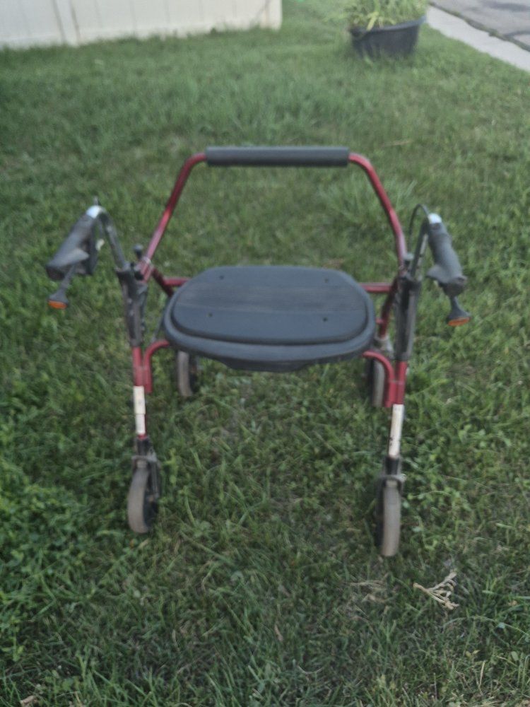 Red Four-Wheel Rolling Walker Rollator with Padded Seat and Hand Brakes